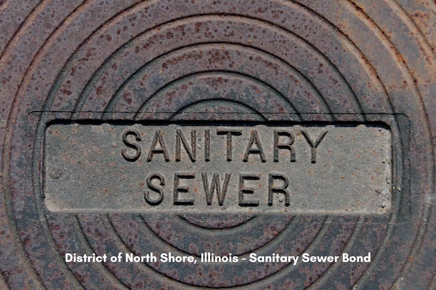 District of North Shore, IL - Sanitary Sewer Bond - Sanitary sewer imprinted on an iron cover for a sewer system.
