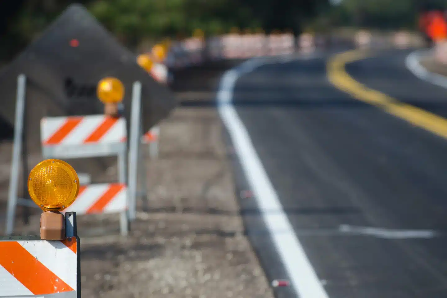 Construction barriers along a road under construction.