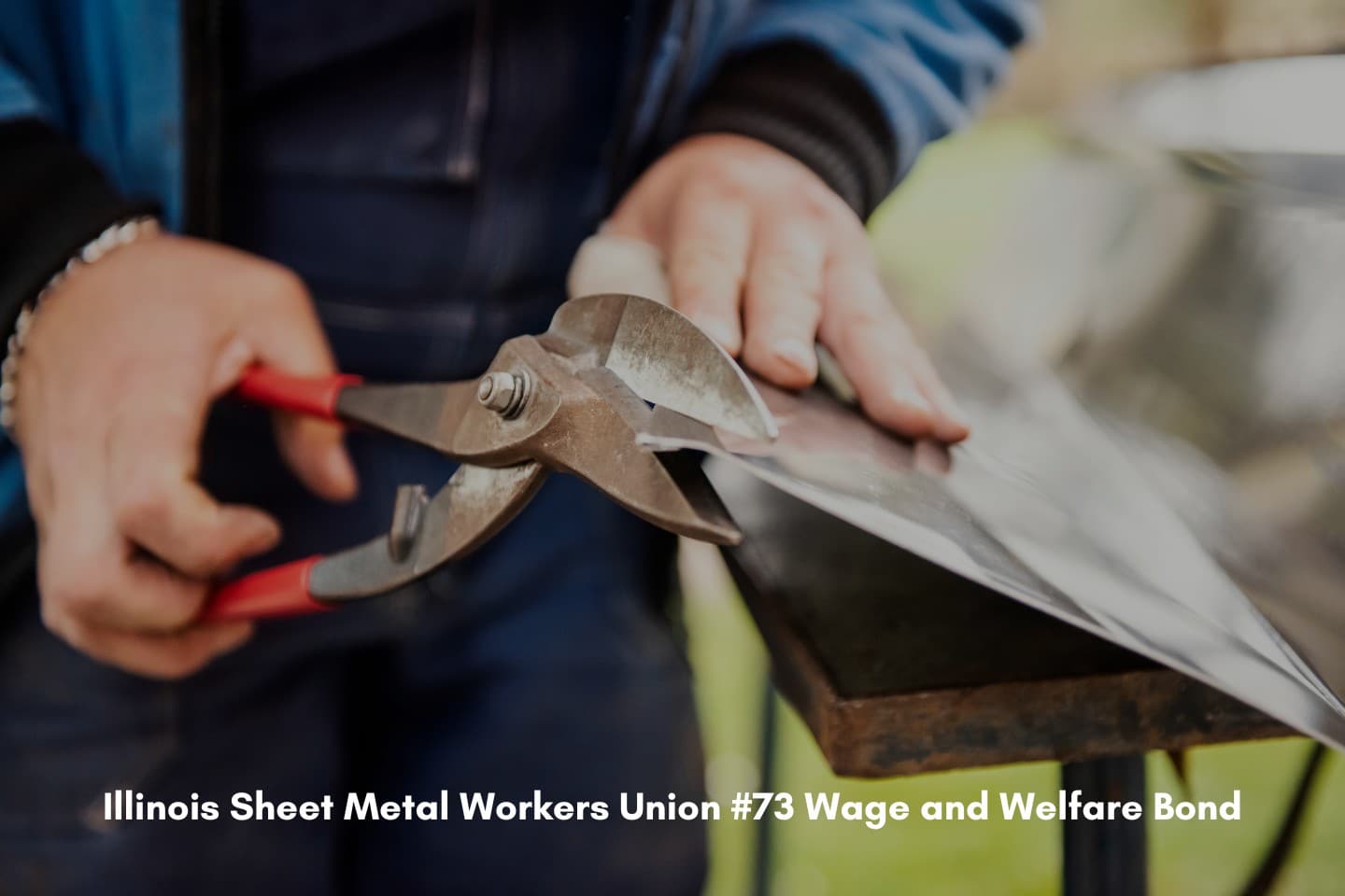 Illinois Sheet Metal Workers Union #73 Wage and Welfare Bond - Metal worker cutting sheet metal.