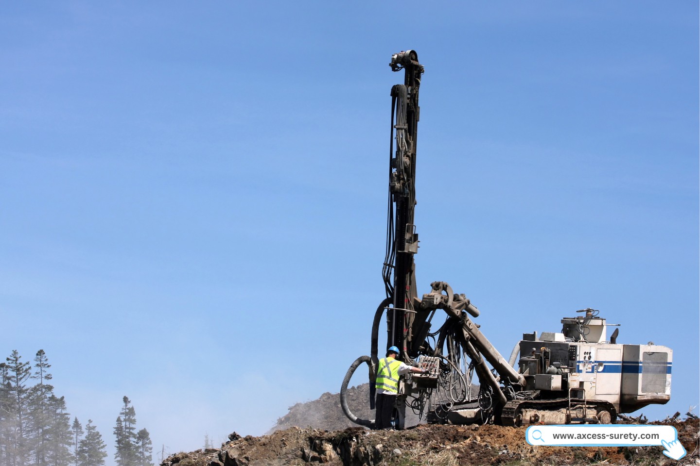 Rock drilling machine in operation. Operated by a well drilling worker.