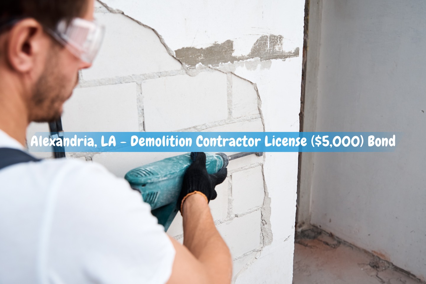 Alexandria, LA - Demolition Contractor License ($5,000) Bond - Man knocking down stucco on wall using demolition hammer.