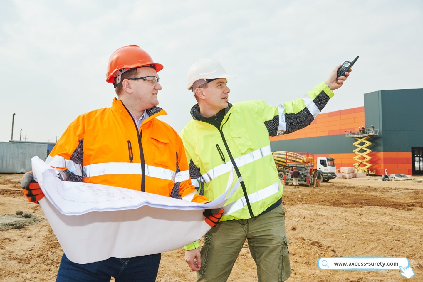 At the construction site, construction managers who are male engineers carrying radios and plans.