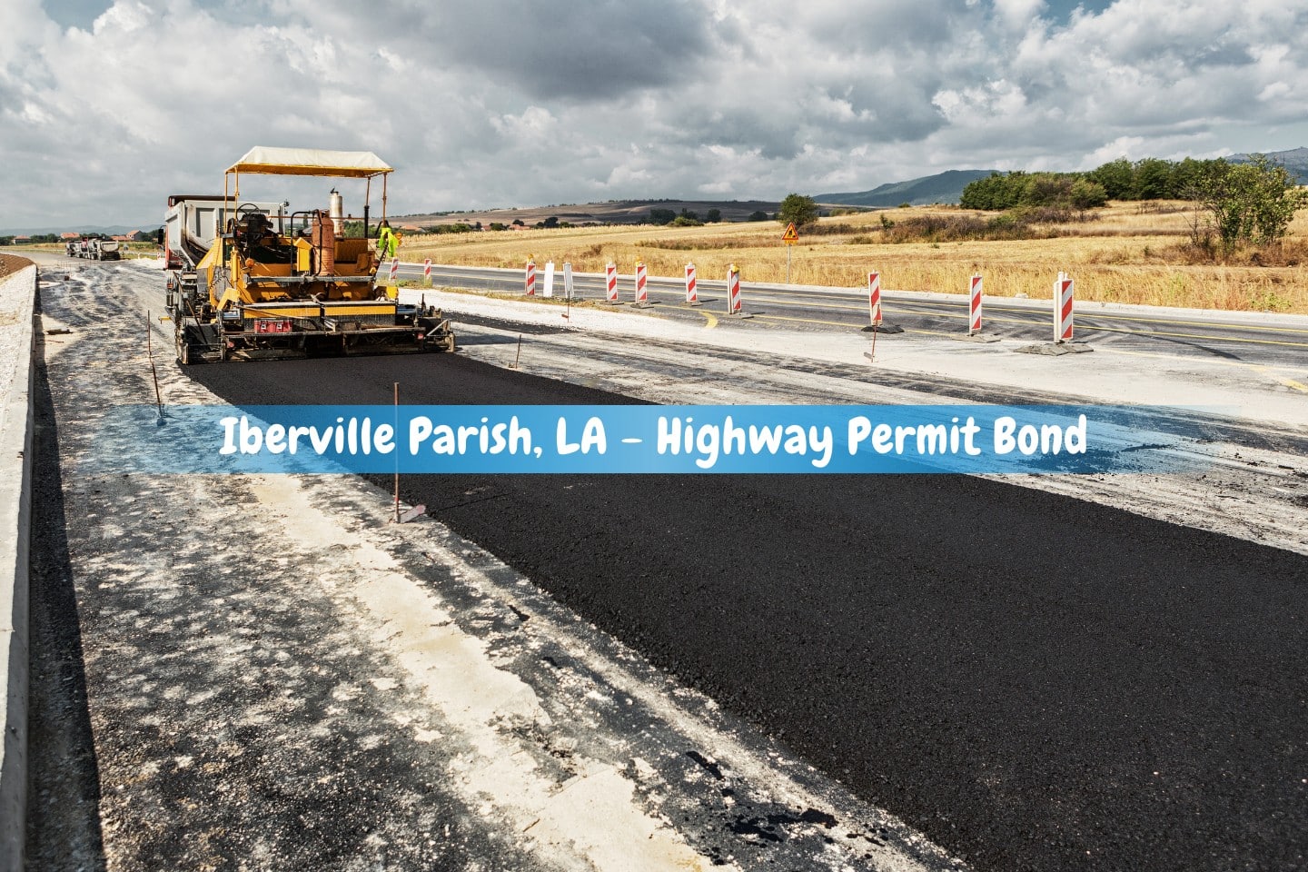Iberville Parish, LA - Highway Permit Bond - During highway building, a pavement machine applies new asphalt on top of the gravel base.