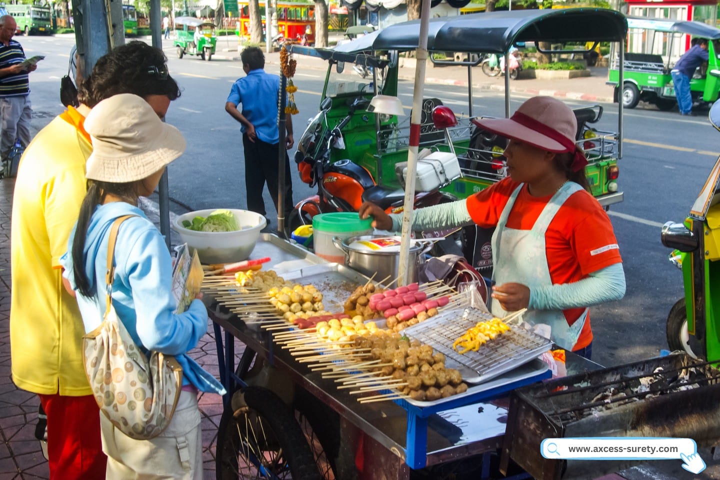 A woman as an itinerant vendor selling street foods.