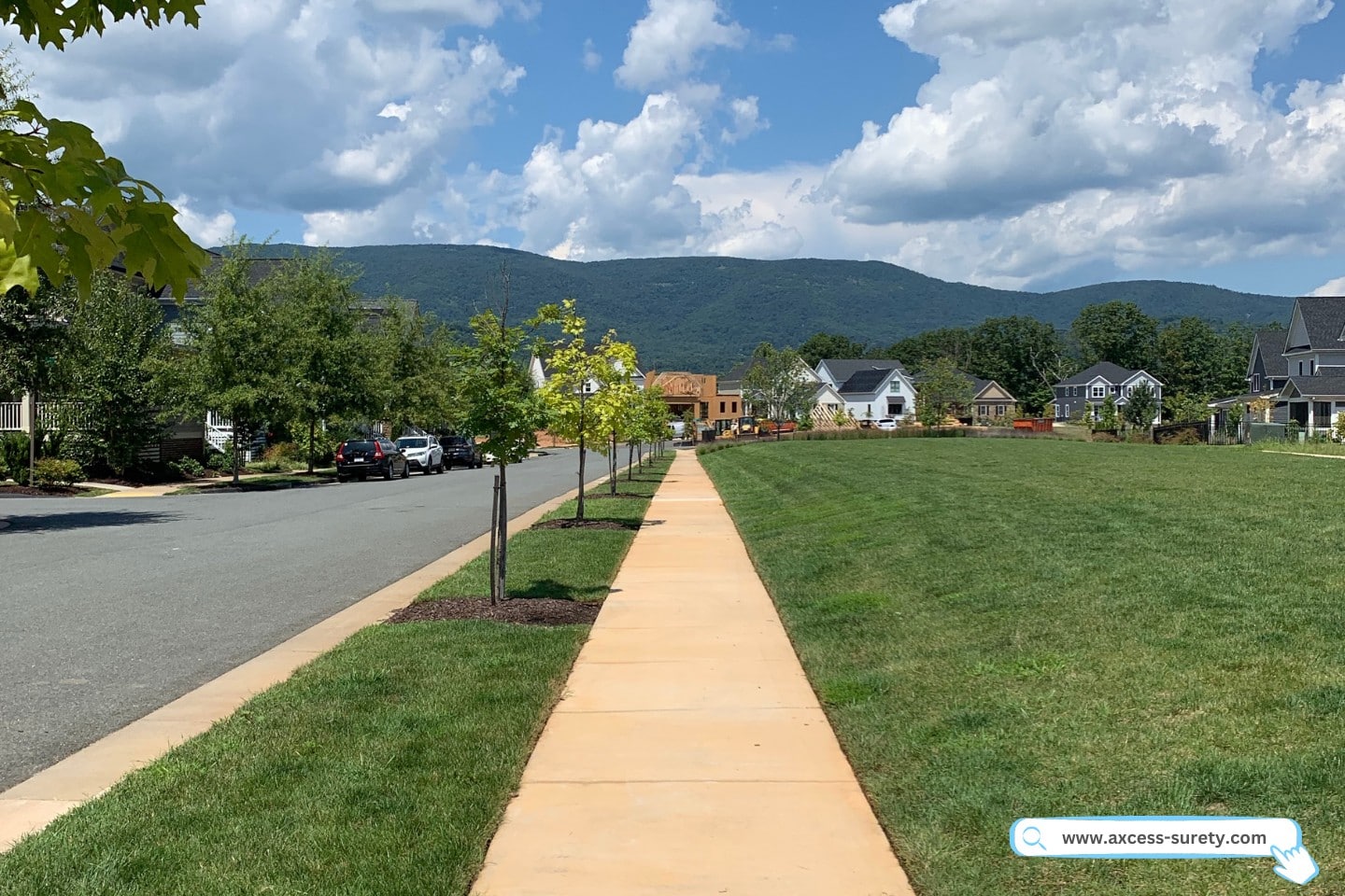 Walking on the sidewalks toward the mountains on a beautiful afternoon.