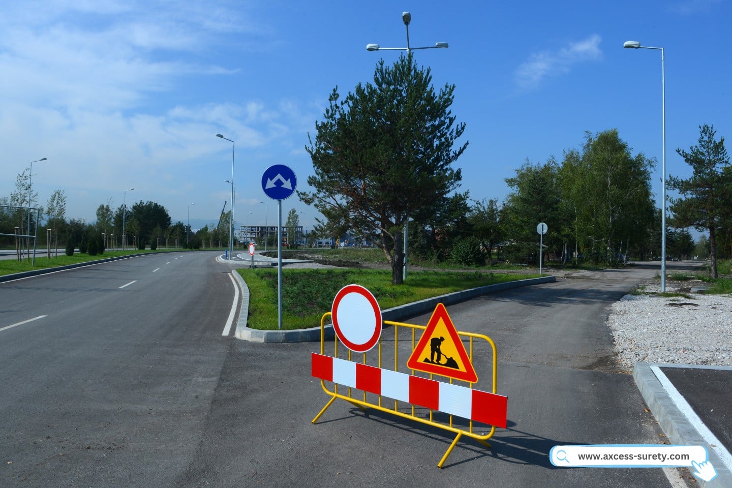 A road work sign indicates that construction is taking place on the street.