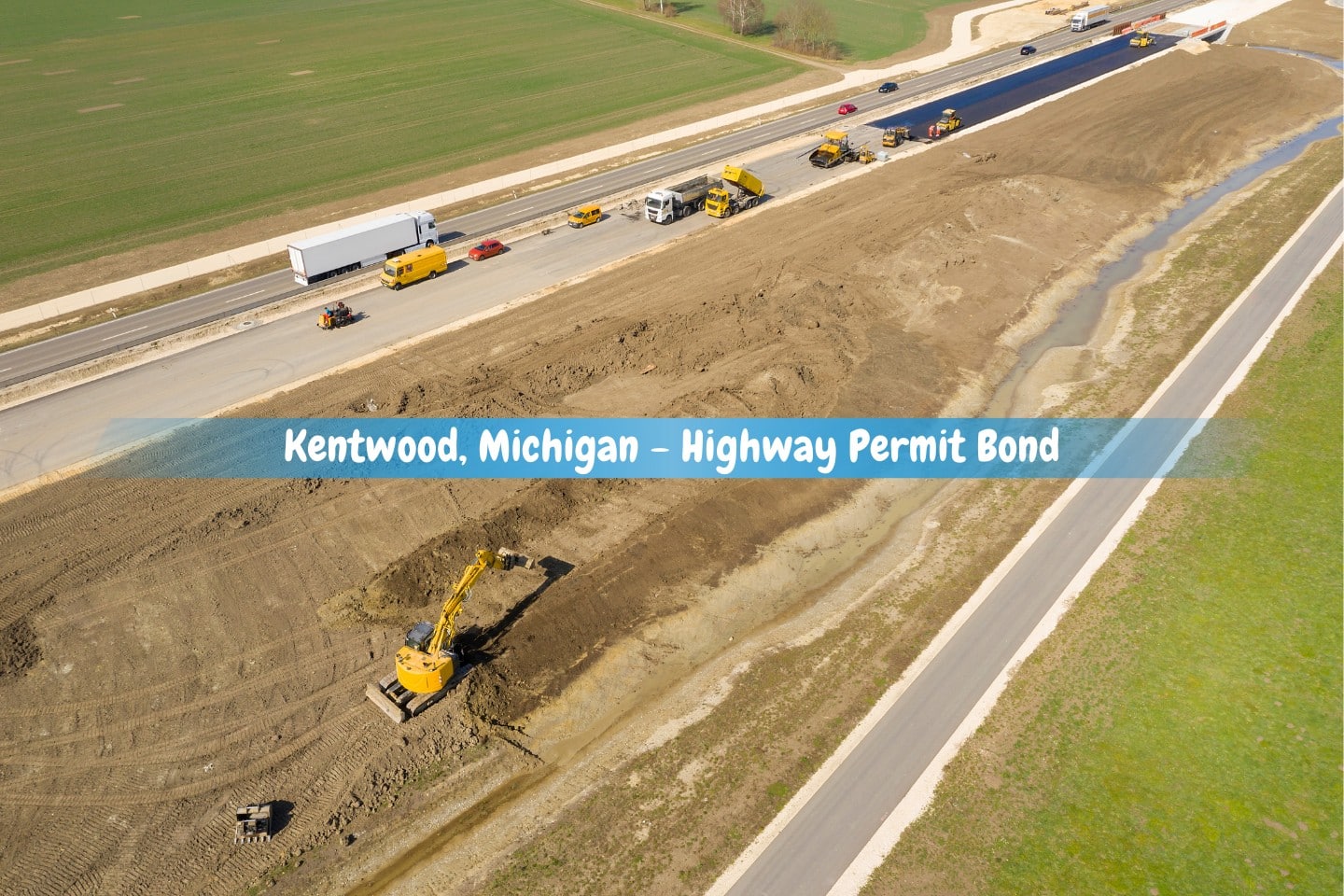 Kentwood, Michigan - Highway Permit Bond - Asphalt paver machine, as well as other construction machines and vehicles, are used during asphalting work on a new roadway.