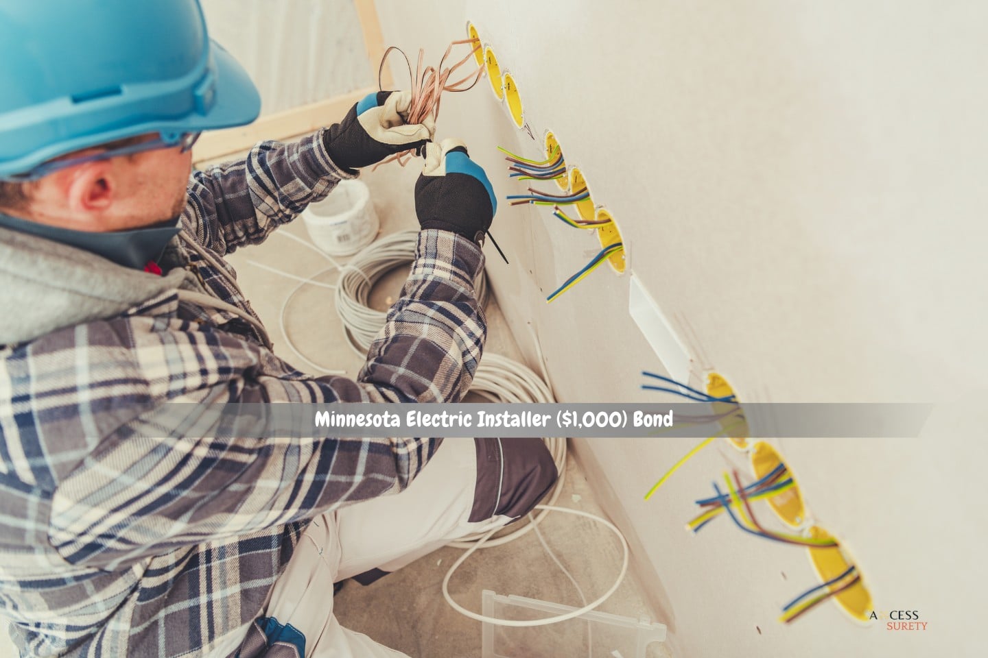 Minnesota Electric Installer ($1,000) Bond - Several wall power outlets are being installed simultaneously by an electrician.