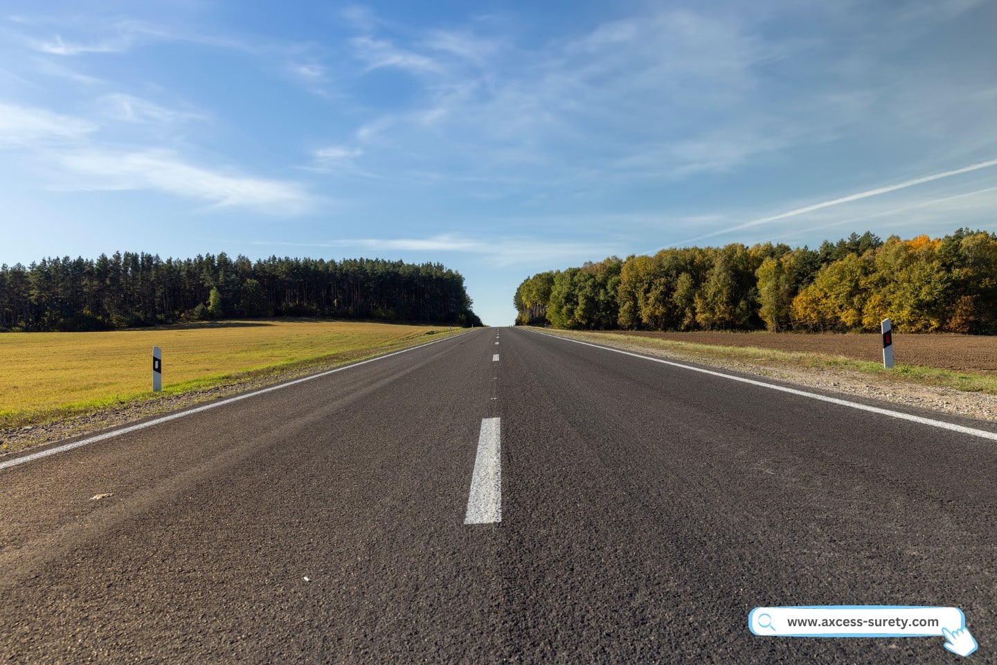 A straight roadway without traffic, a summer scene with an empty highway.