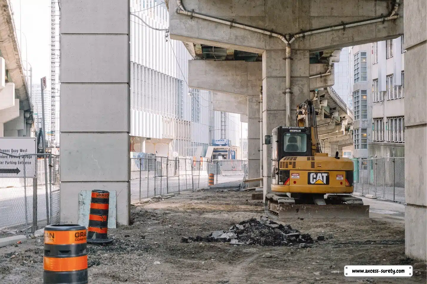 A huge equipment beneath the bridge site. Under the bridge is a construction site.