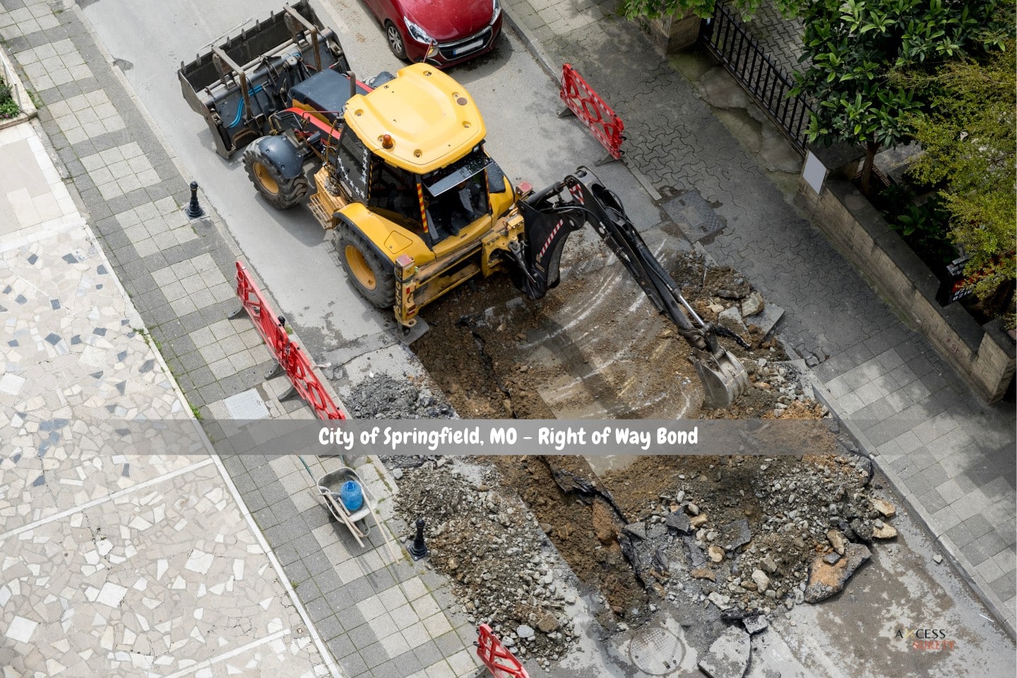 City of Springfield, MO - Right of Way Bond - On a summer day, an excavator fixes sewage storm drains at a roadway.