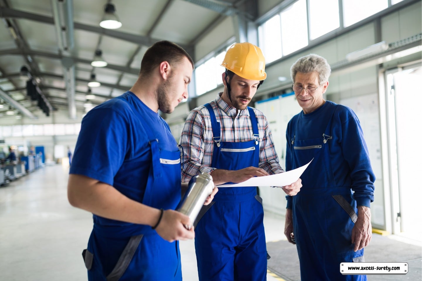 An engineer from the supplier is monitoring factory production.