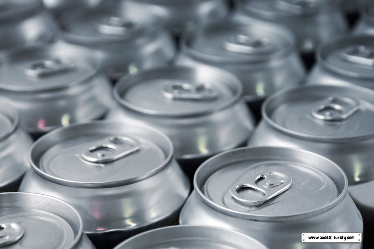 Cans of beer or soda are arranged in rows.