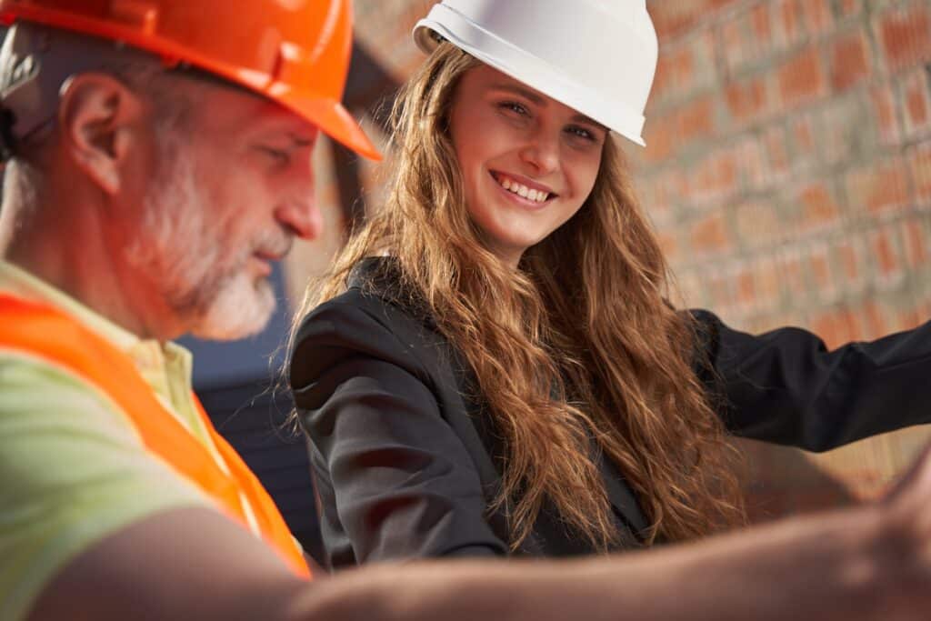 cheerful-woman-in-hardhat-feeling-great-about-her-2023-11-27-05-26-57-utc_11zon