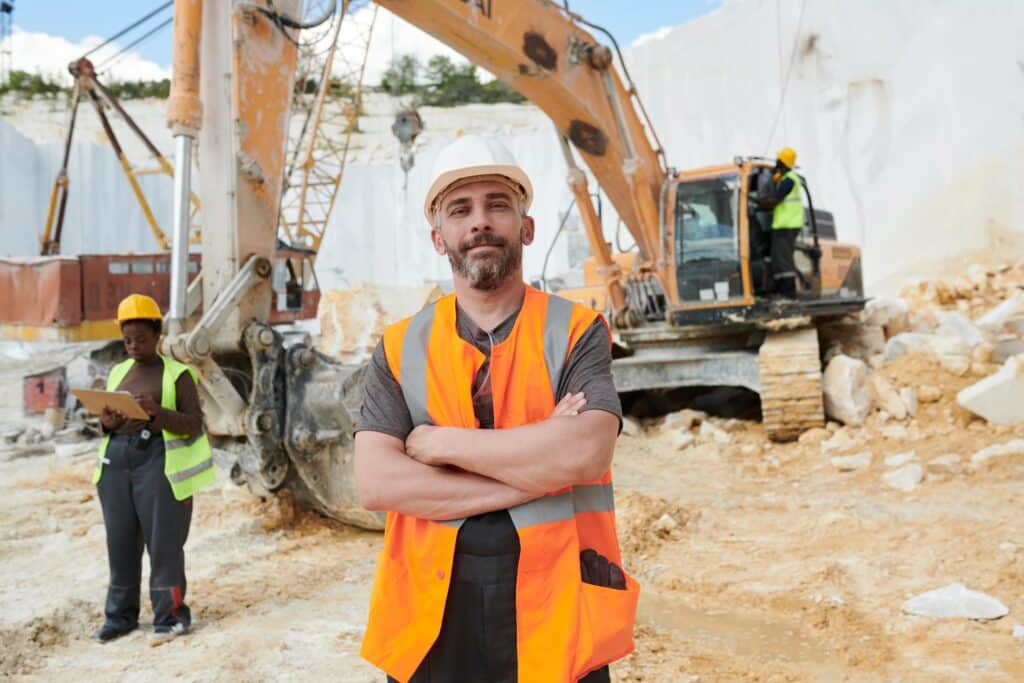 confident-foreman-in-reflective-vest-and-safety-he-2023-11-27-05-06-10-utc-min