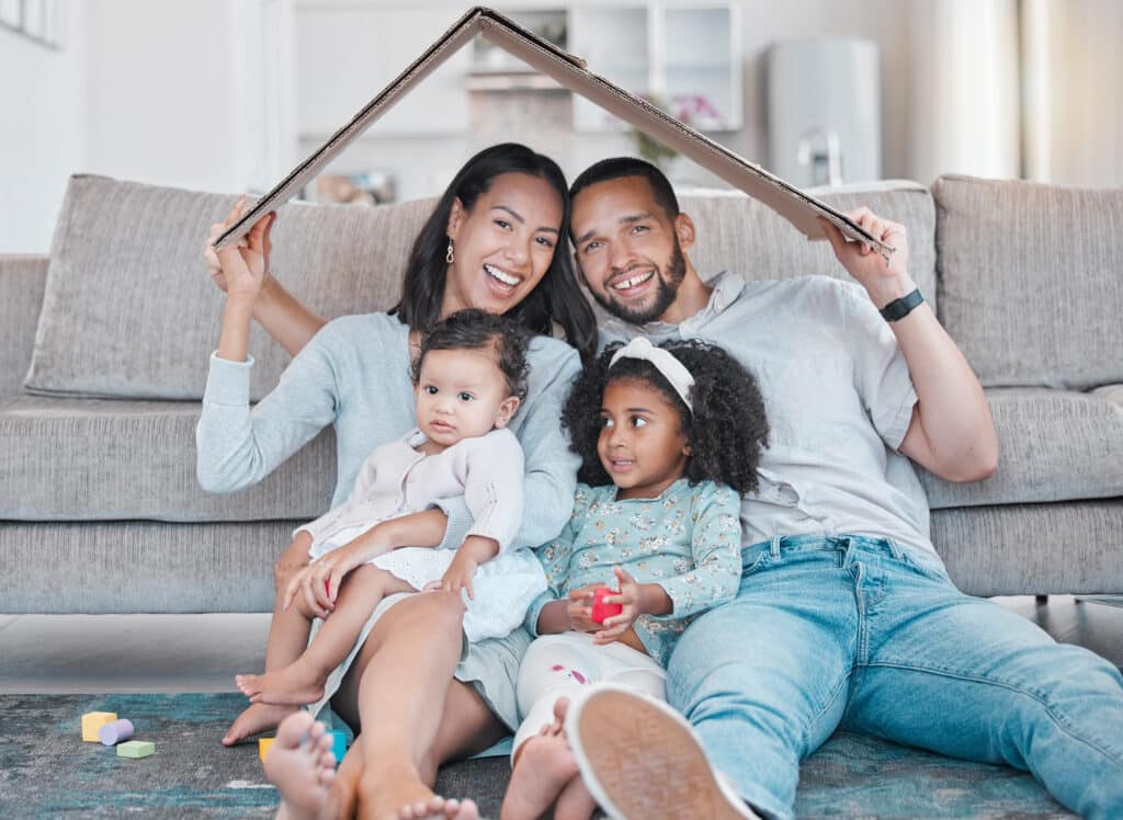 Happy family, new house and cardboard roof in living room, mortgage loan and investment security fo.