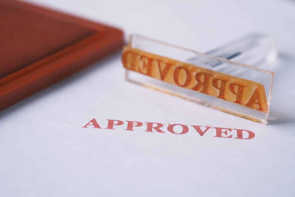 Stamping Document with Approving Contract close up .