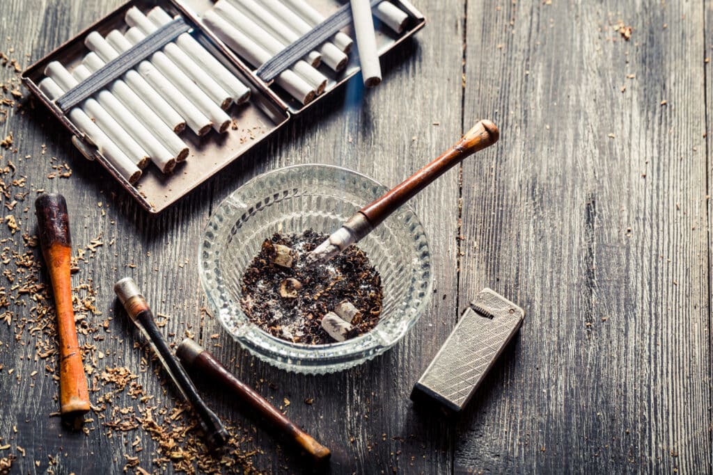 thin-pipe-with-burning-cigarette