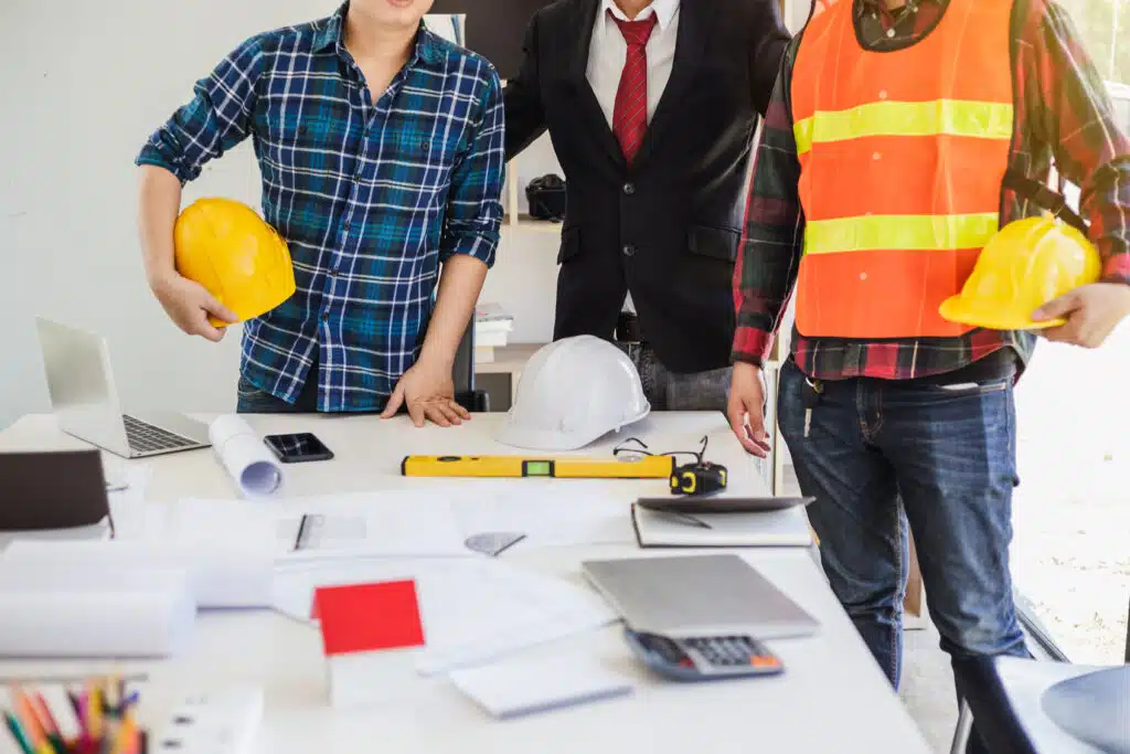 Teamwork process, Engineer and businessman meeting and planning construction project together.