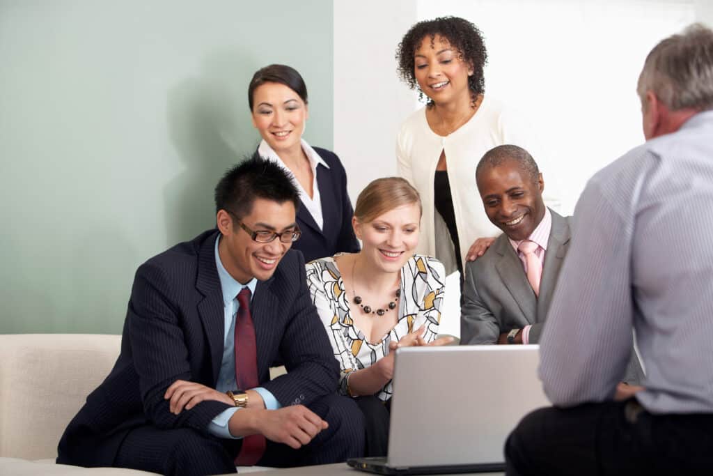 A business group around a laptop