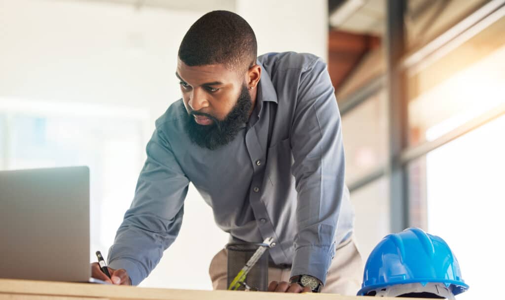 Architecture man, laptop and blueprint planning, construction design and project management for ren.