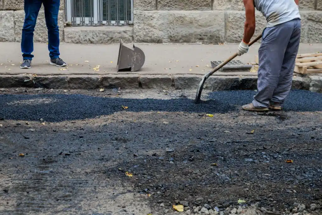 Bad road street resurfacing. Fresh asphalt construction.