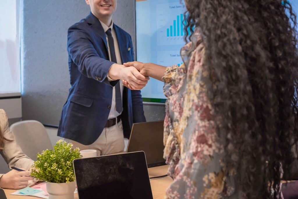 business-man-shake-hands-with-business-women-agree-2024-02-14-10-59-48-utc