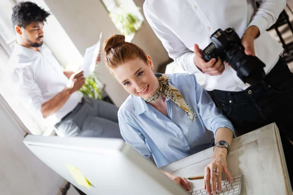 Business, technology and people concept - creative team or designers working on user interface at office