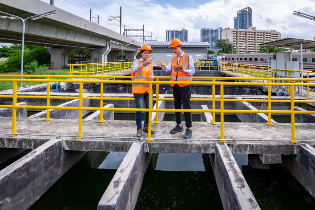 engineer-take-water-from-wastewater-treatment-pond-2023-11-27-05-00-37-utc_11zon
