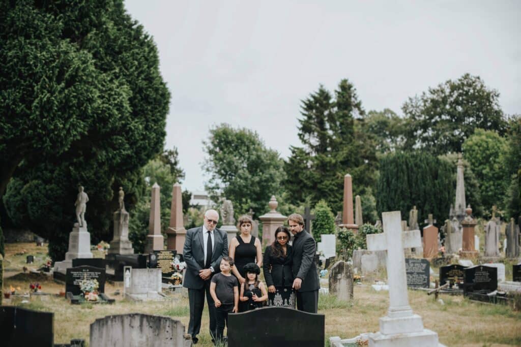 family-giving-their-last-goodbyes-at-the-cemetery-2023-11-27-05-01-23-utc_11zon