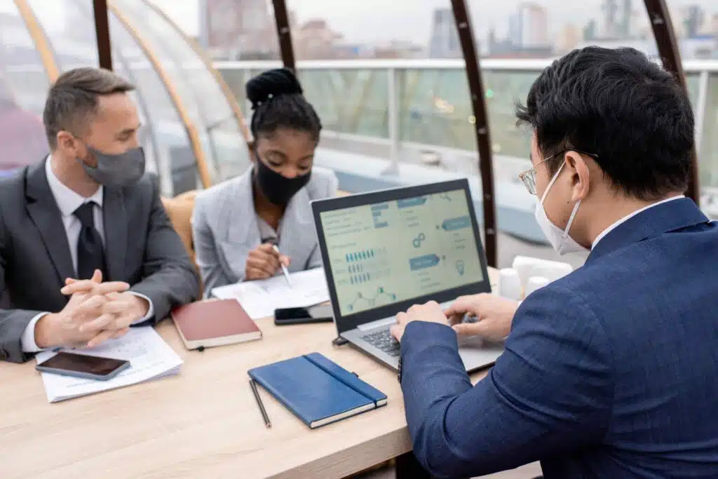 group-of-young-intercultural-coworkers-sitting-by-2023-11-27-05-06-28-utc