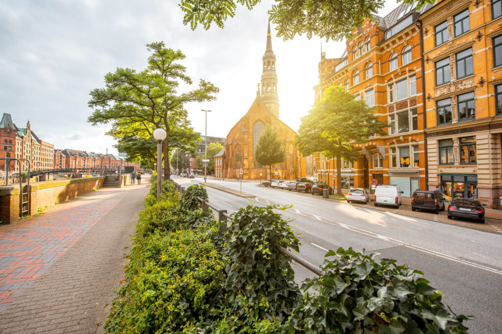 Beautiful cityscape view on the old downtown with saint Catherines church during the sunset in Hamburg city, Germany