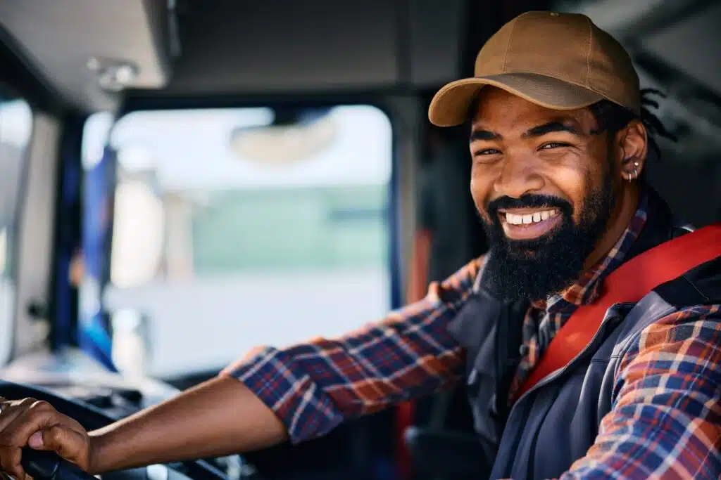 happy-black-professional-truck-driver-looking-at-c-2024-01-30-00-31-32-utc_11zon