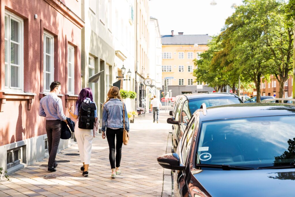 rear-view-of-friends-walking-on-sidewalk-in-city-2023-11-27-04-49-38-utc_11zon