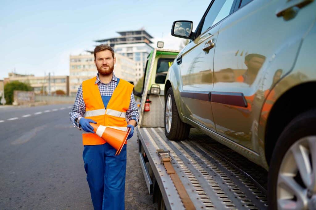 road-worker-putting-traffic-cone-on-roadside-2023-11-27-04-59-07-utc_11zon