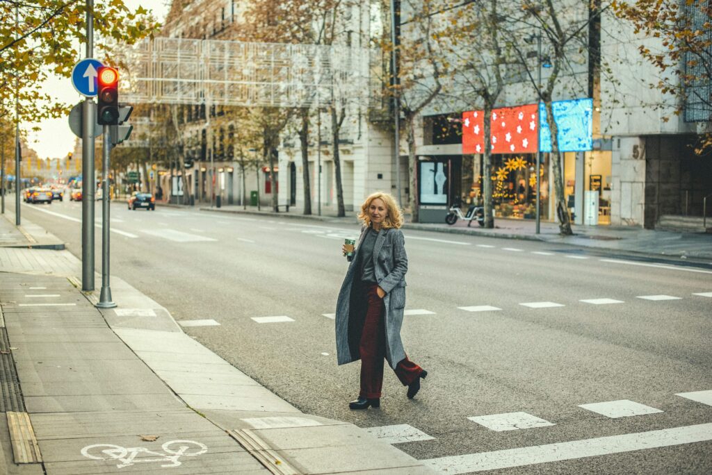 stylish-caucasian-female-walking-on-a-street-with-2023-11-27-05-01-21-utc_11zon
