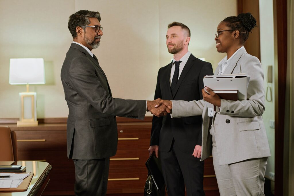 businesswoman-shaking-hand-of-partner-2024-07-16-15-46-41-utc_11zon