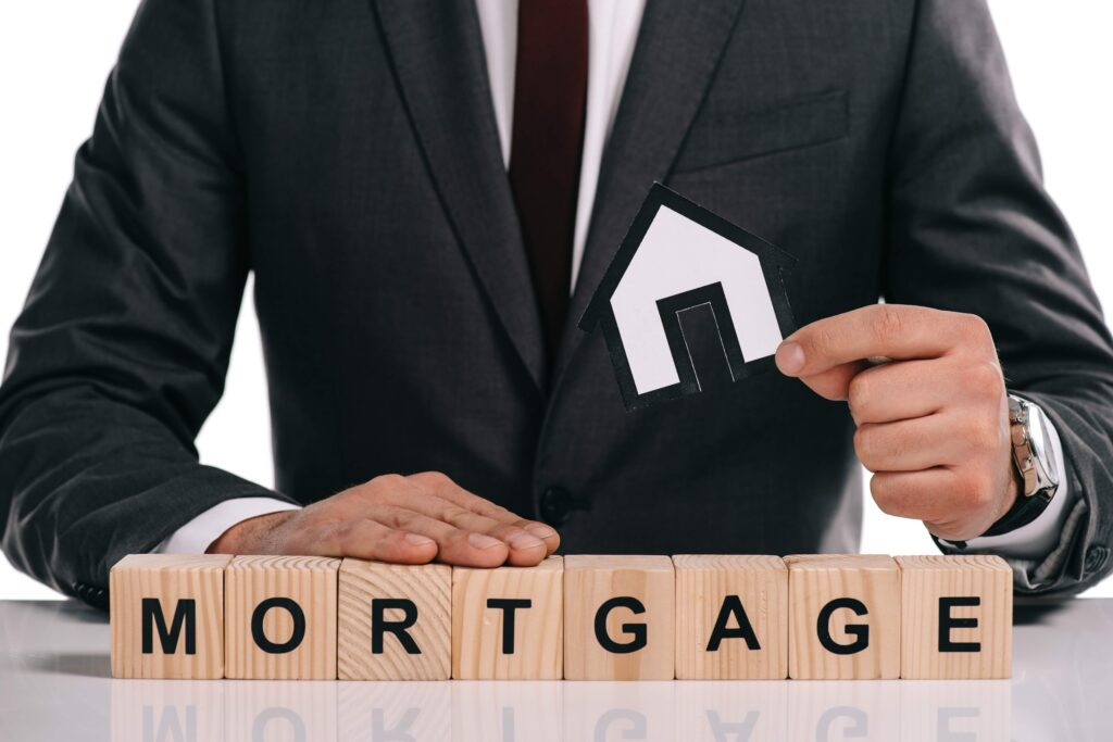 cropped-view-of-mortgage-broker-holding-paper-hous-2023-11-27-05-05-54-utc_11zon