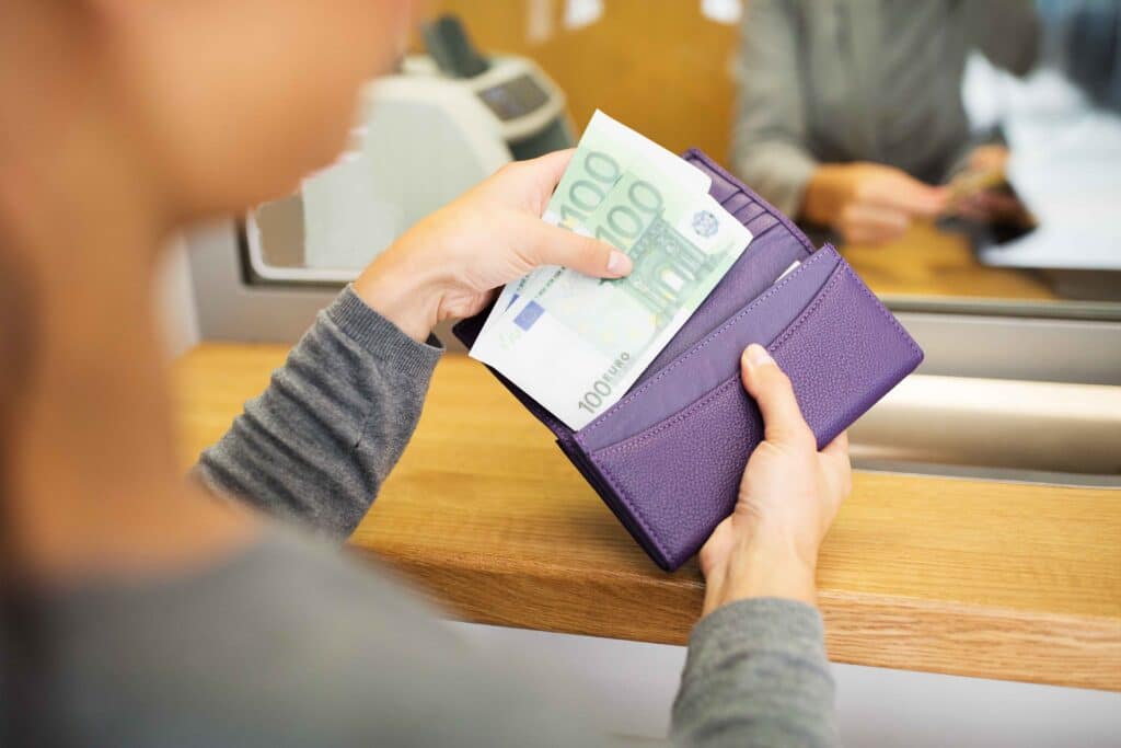 hands-with-money-at-bank-or-currency-exchanger-2024-09-27-15-45-27-utc_11zon