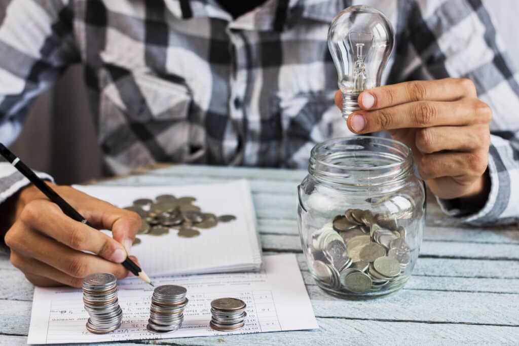 high-angle-man-calculating-savings