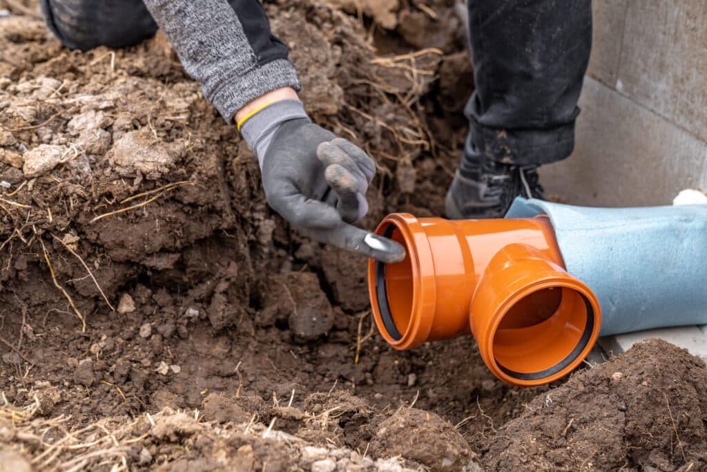 plastic-pvc-waste-sewer-pipe-in-the-ground-constr-2023-11-27-04-58-55-utc_11zon