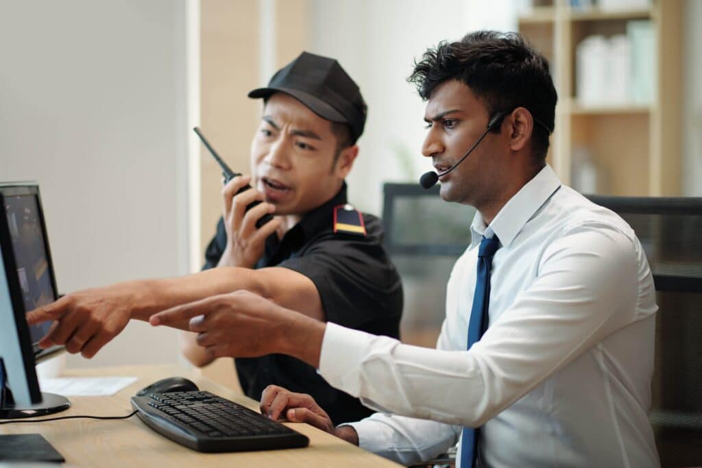 security-operators-at-office-desk-2023-11-27-05-22-09-utc_11zon