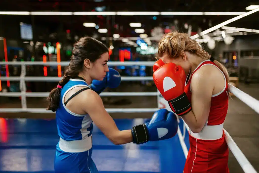 women-in-red-and-blue-gloves-boxing-on-the-ring-2023-11-27-05-23-17-utc_11zon