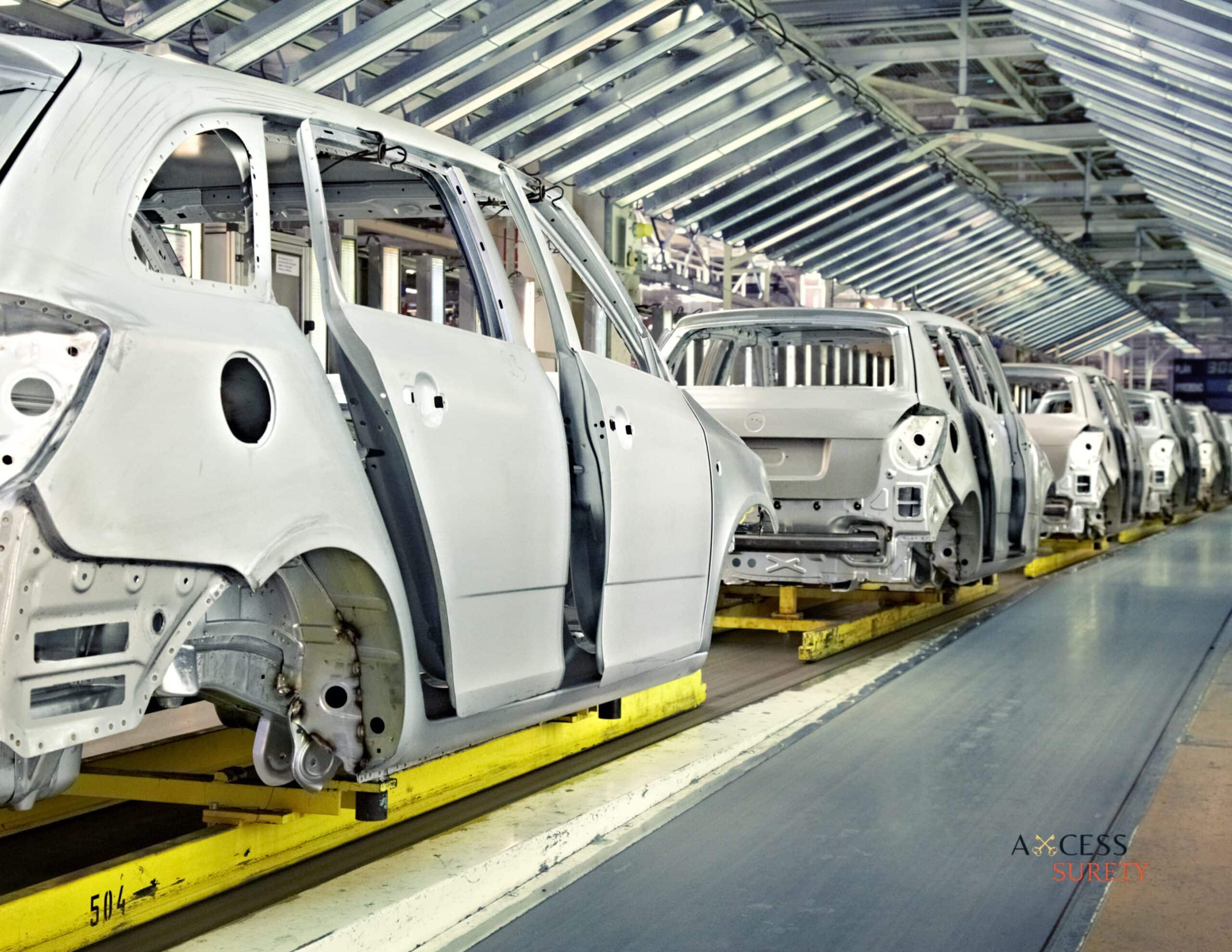 a row of automobiles assembled at the cat facility.