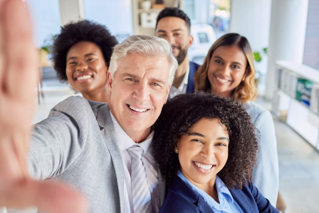 Teamwork, friends and selfie with business people in office for social media, diversity and support.