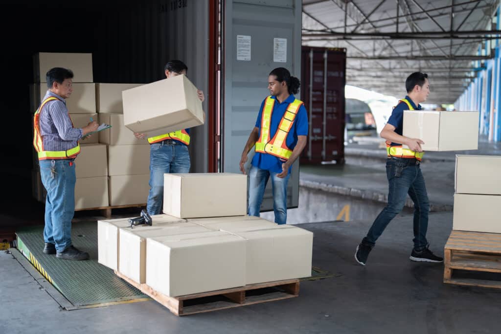 Workers open steel 40 feet container doors carry box supervisor standing check paper checklist