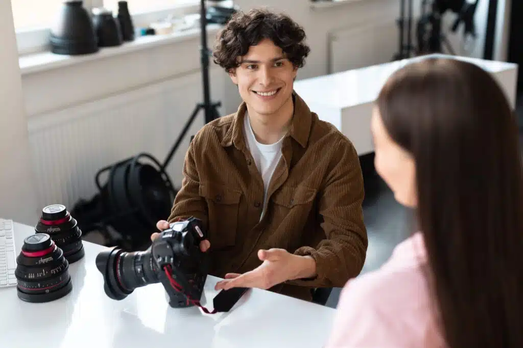 cheerful-male-photographer-talking-with-model-dis-2023-11-27-05-18-12-utc_11zon