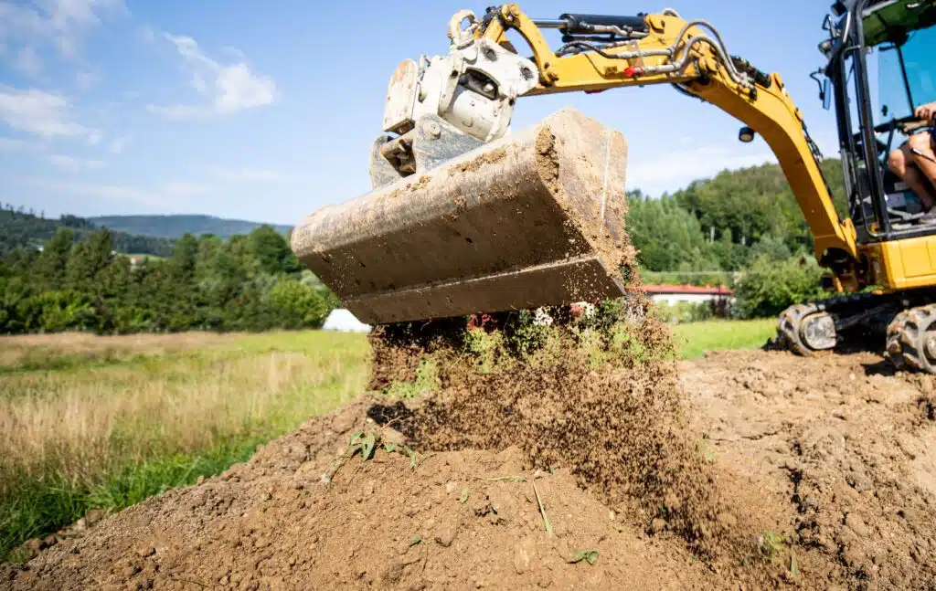 mini-excavator-bucket-closeup-during-work-on-const-2024-10-31-04-18-31-utc_11zon