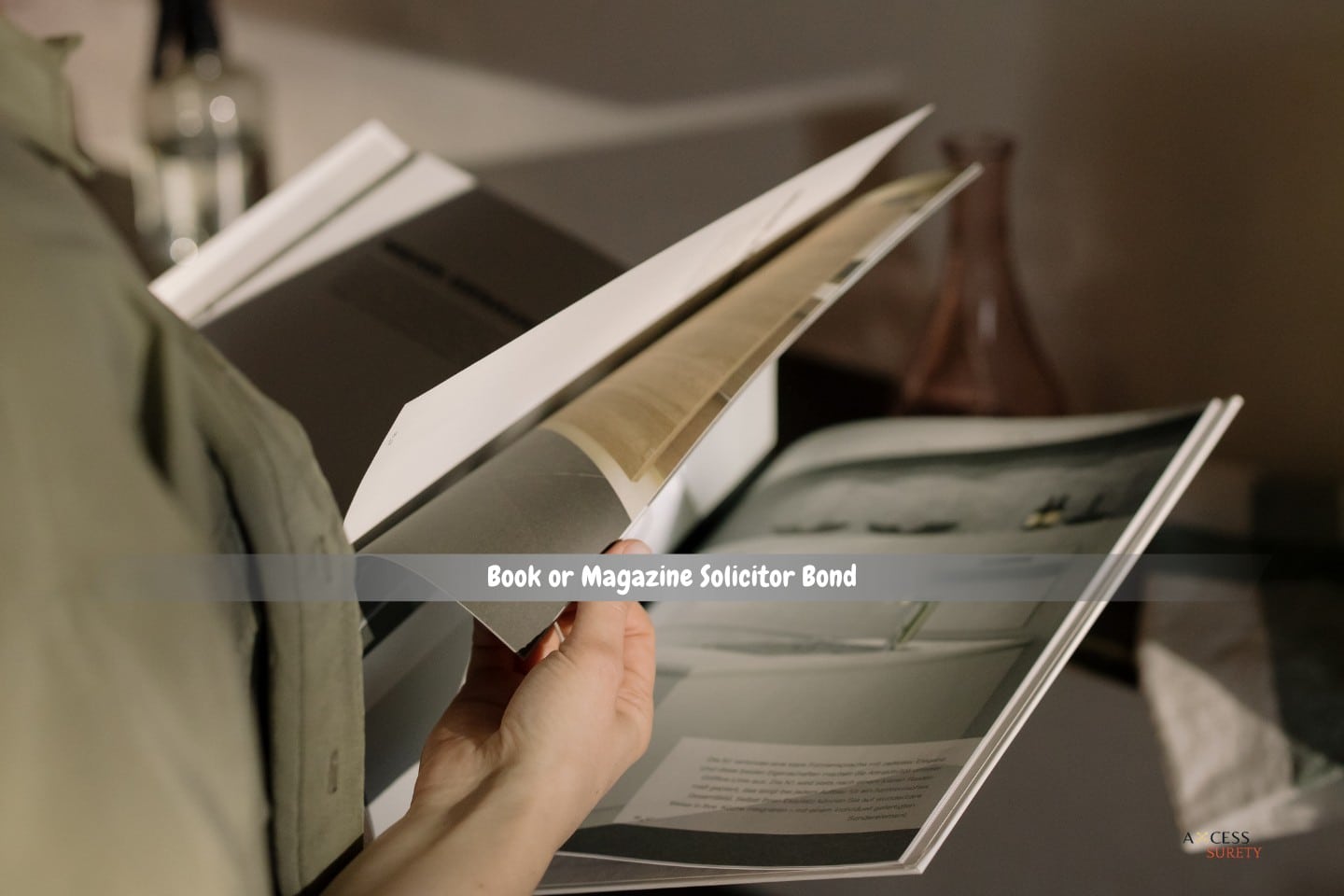 Book or Magazine Solicitor Bond - A person flipping through a magazine.