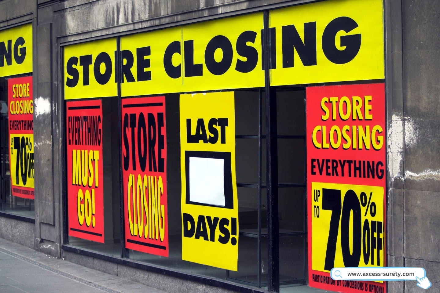 Discount and store closing notices shown in department store displays.
